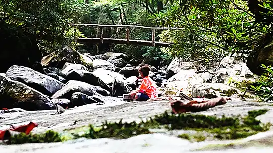 Dr. Gwen Ford relaxing by the river 